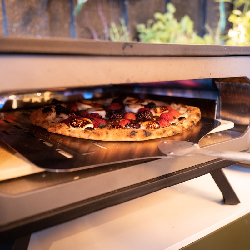 Pietra piastra forno refrattaria con pala in legno per pizza